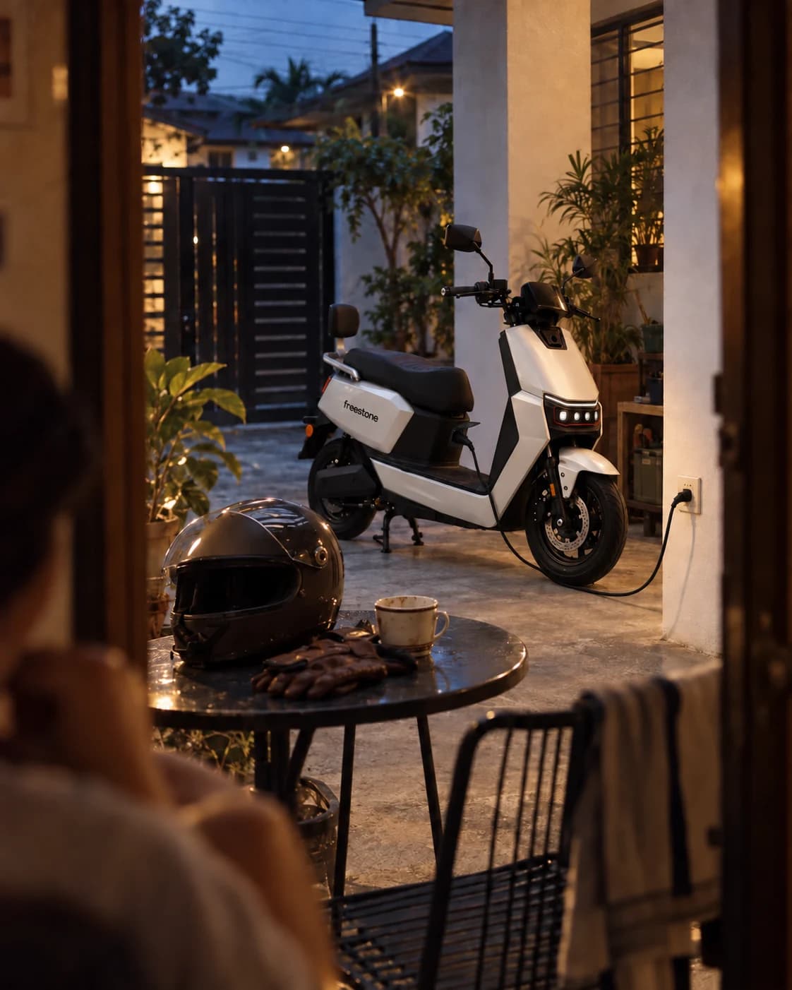 Pearl White Freestone 01 connected at its inner-apron charging port at a Philippine home in the evening